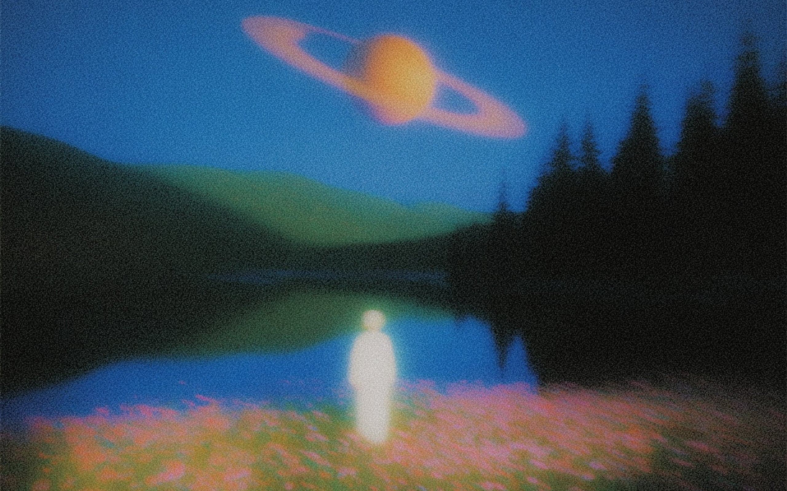 Saturn glowing over a quiet meadow and lake at dusk
